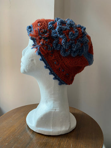 Knitted Blue and Orange cloche with beaded rosette
