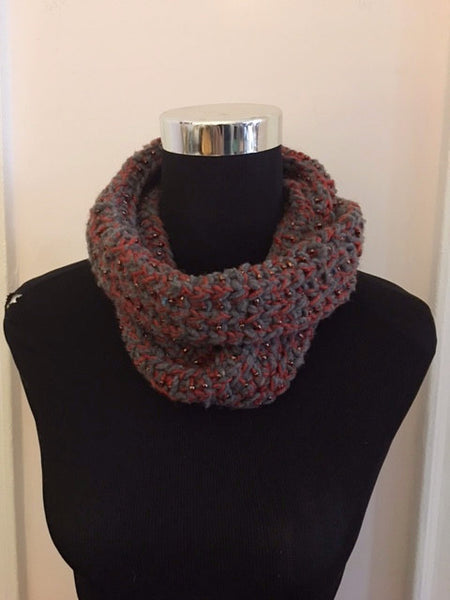 Knitted cowl in orange and blue-gray with seed beads