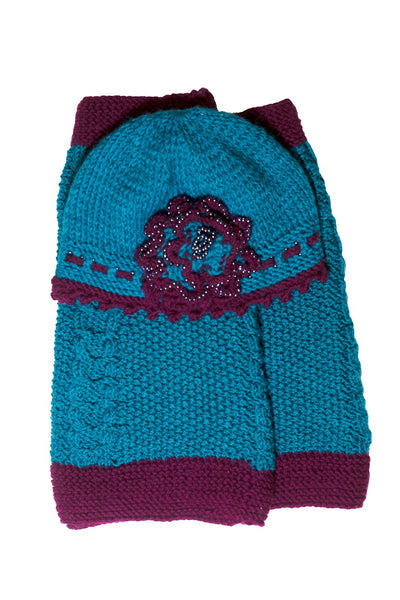 Knitted Pacific blue cloche hat with seed beads and rosette
