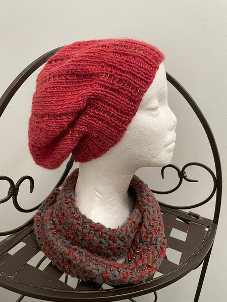 Knitted beanie in orange with gold seed beads