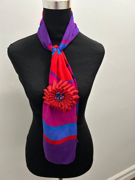 Multi-colored vintage scarf in aqua, red, and purple with matching flower brooch in red ribbon
