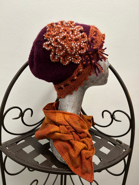 Set- Smocked fabric cowl in orange plaid with matching knitted cloche in purple and orange wool with pearl beading