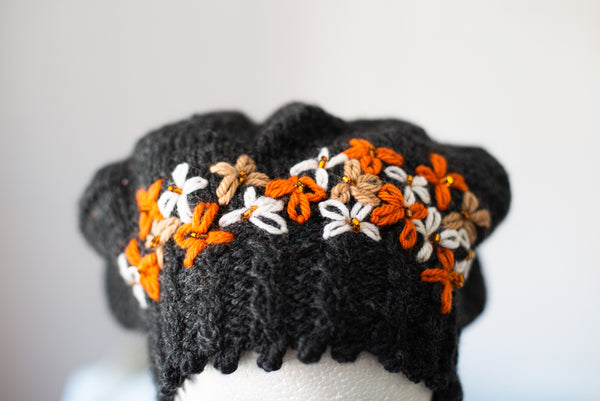 Black beret with embellished flowers