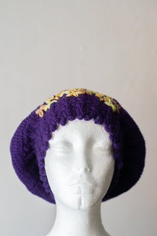 Purple beret with embellished flowers