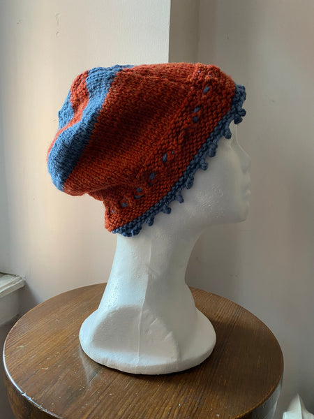 Knitted Blue and Orange cloche with beaded rosette