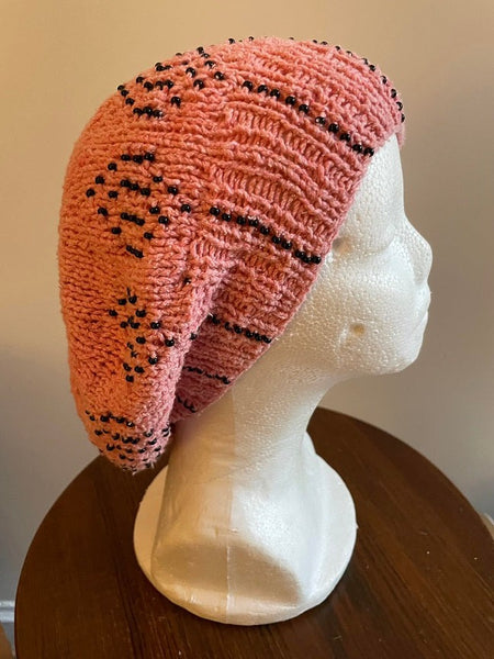 Knitted cotton and silk beanie in coral with black seed beads