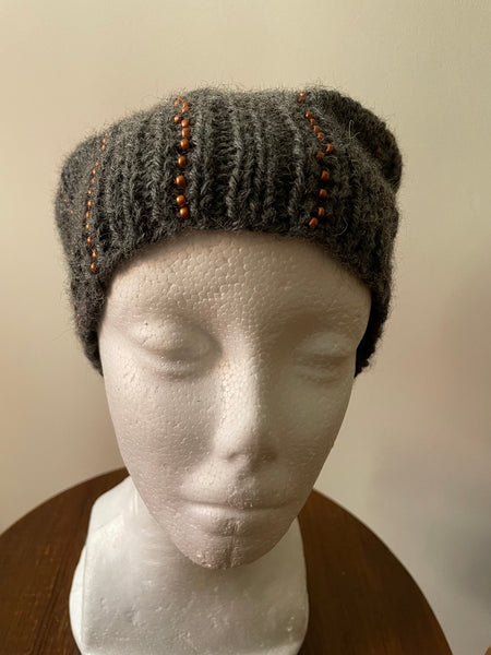 Knitted beanie in gray with copper seed beads
