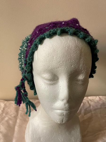 Purple knitted cloche with pearl seed bead trim