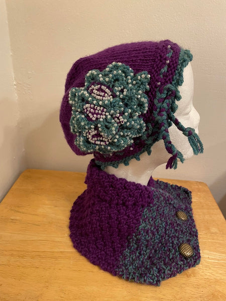 Knitted cowl in green and purple wool