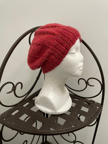 Knitted beanie in orange with gold seed beads